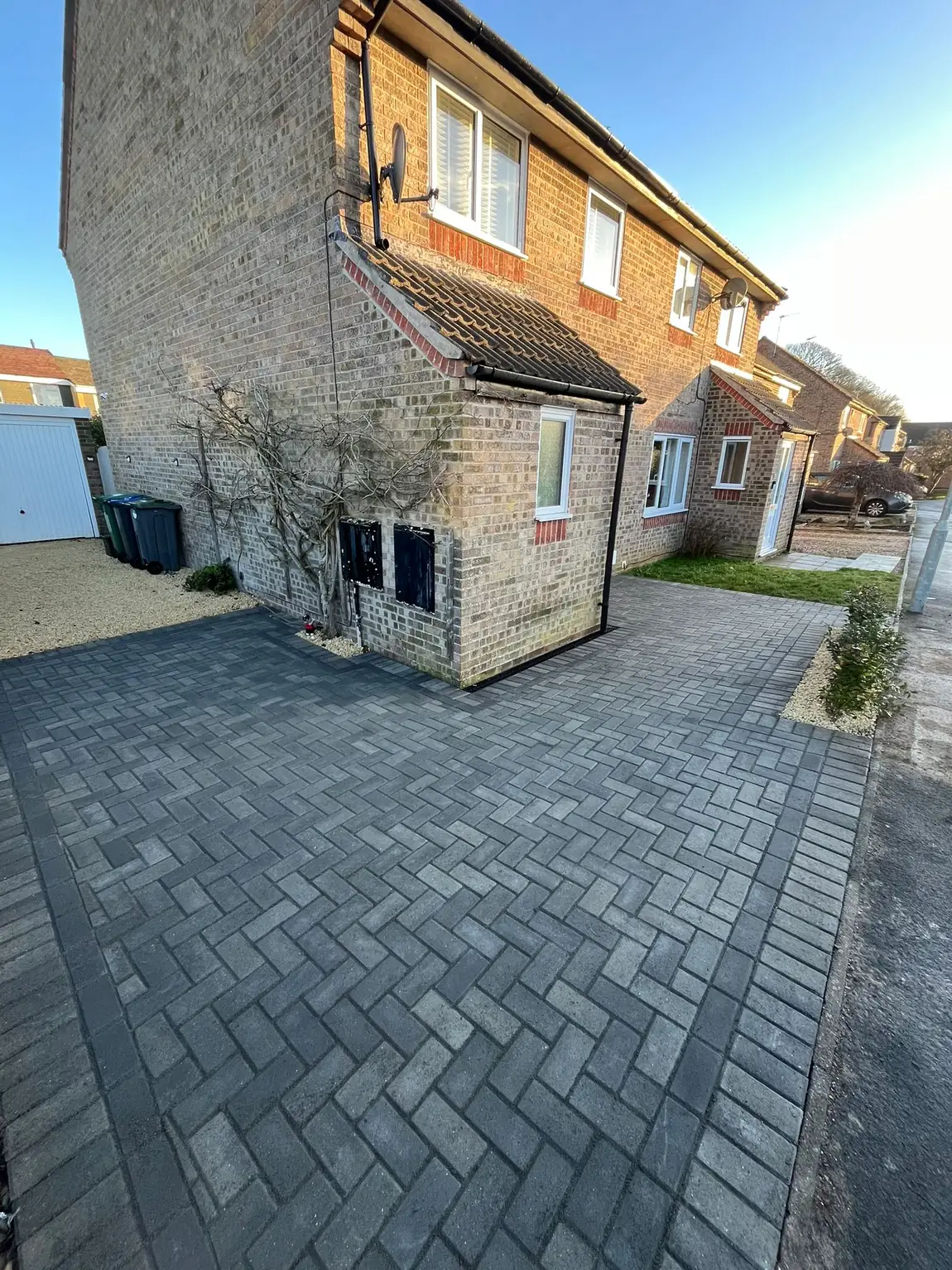 Charcoal herringbone block paving driveway