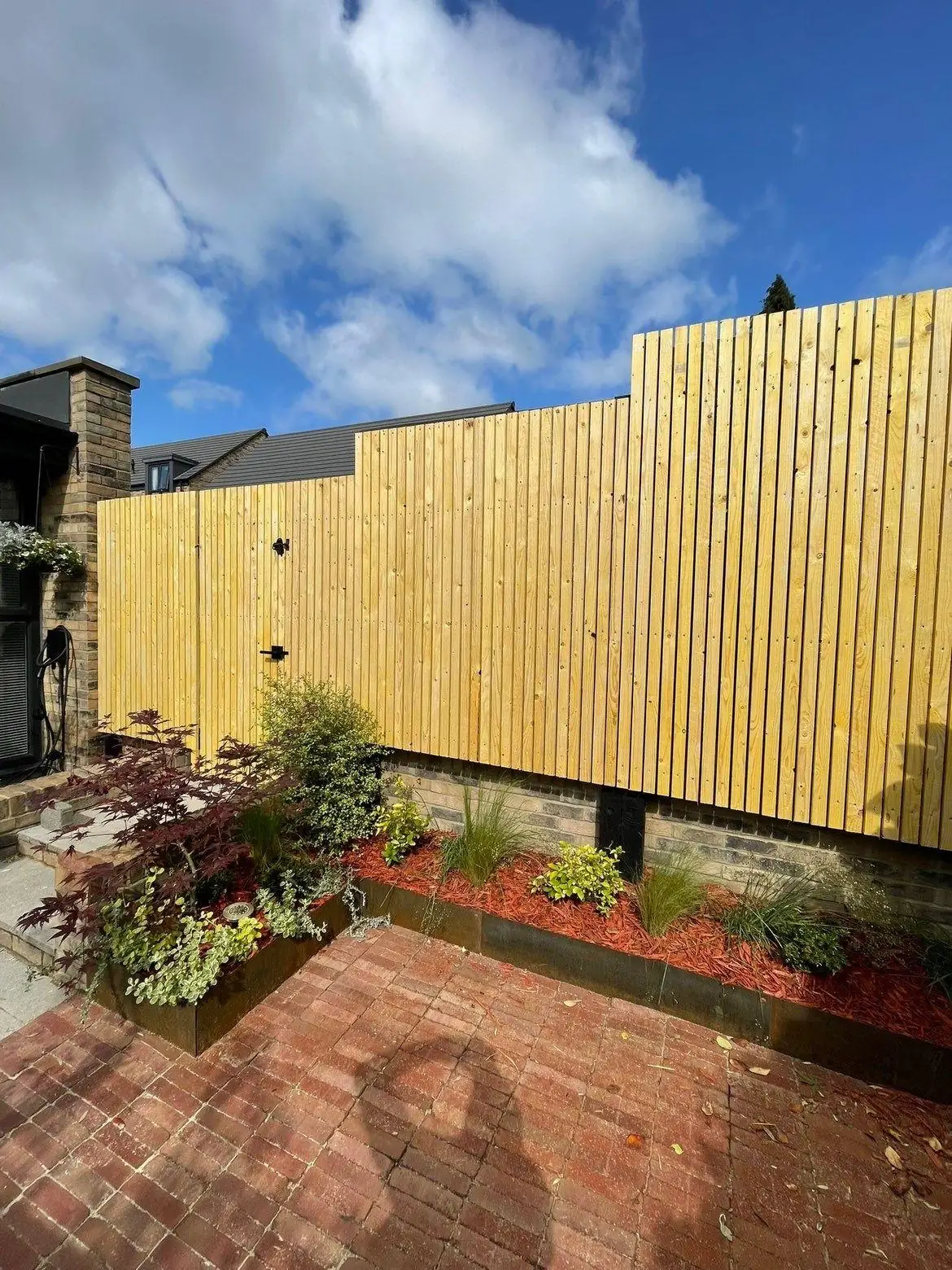 Closeboard fence with brick patio