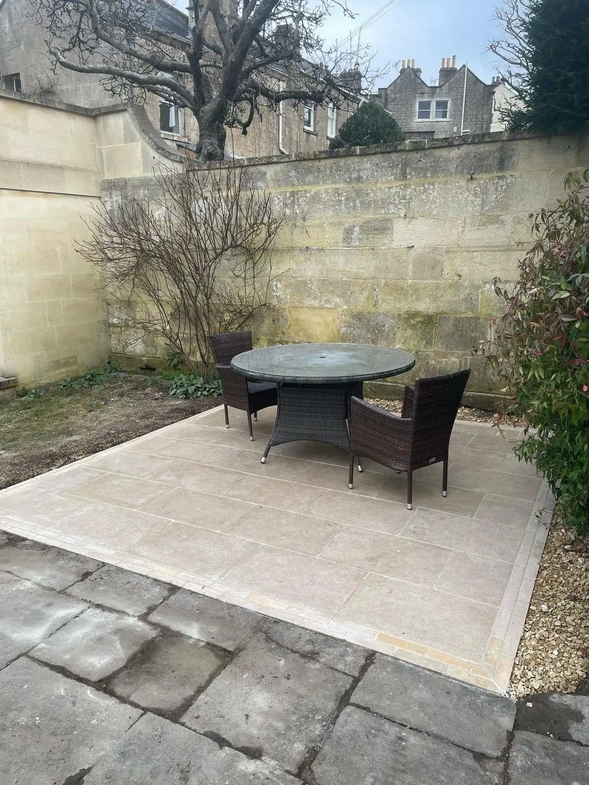 Porcelain patio in walled Bath garden